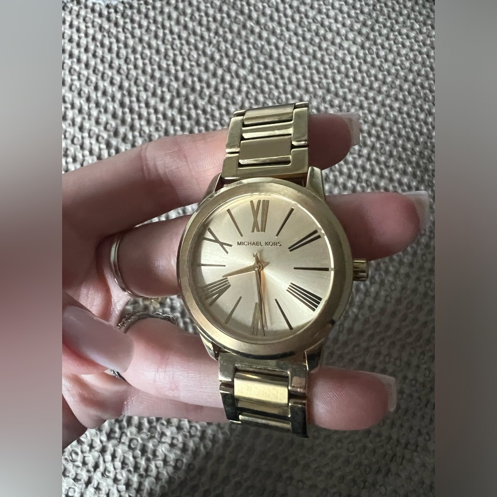 Women’s gold Michael kors watch